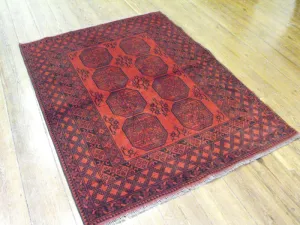 A Hardy Red Afghan Rug: 193cm x 150cm